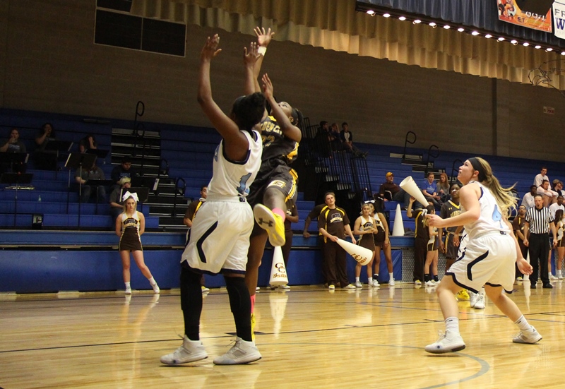 Busters Atop The KJCCC With 71-58 Win Over Trojans